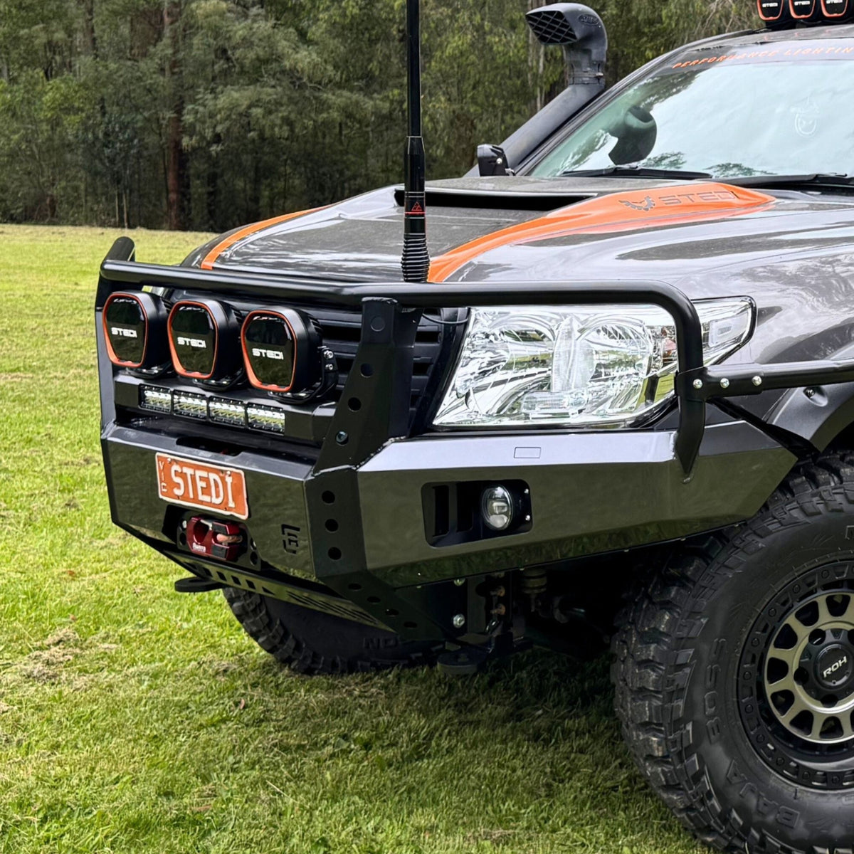 Raslarr Dallas Bull Bar Gunmetal Grey with Black on Toyota Landcruiser 200 Series branded with Stedi lights angle view