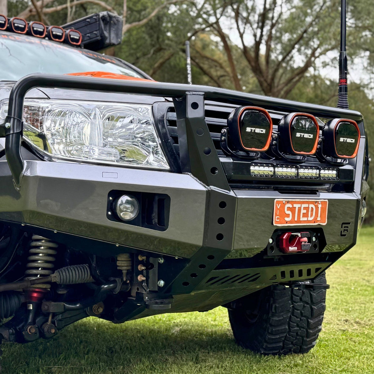 Raslarr Dallas Bull Bar Gunmetal Grey with Black on Toyota Landcruiser 200 Series branded with Stedi lights close up angle view