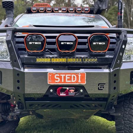 Raslarr Dallas Bull Bar Gunmetal Grey with Black on Toyota Landcruiser 200 Series branded with Stedi lights side view