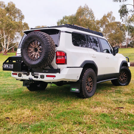 This is an image of the 250 Series Prado Toyota Landcruiser Rear Bar and Wheel Carrier setup by Raslarr Engineering Made in Australia White Black angle