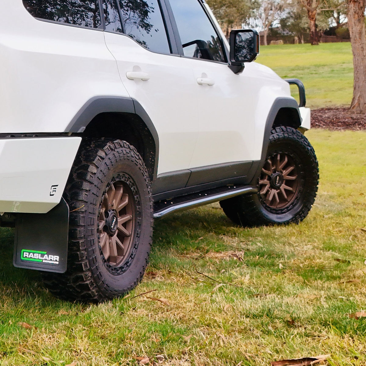 This is an image of the 250 Series Prado Toyota Landcruiser Rock Sliders and side steps Black White