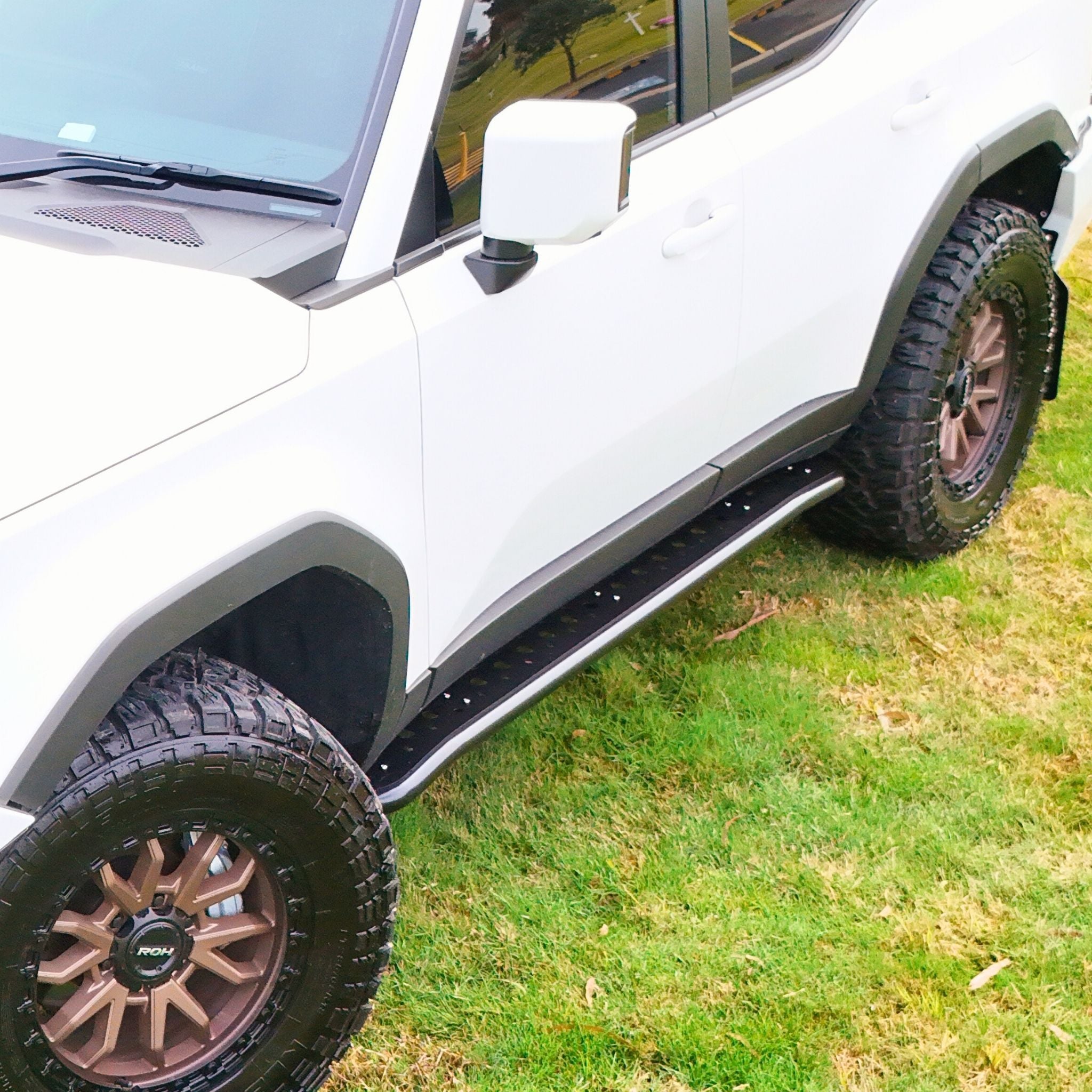 This is an image of the 250 Series Prado Toyota Landcruiser Rock Sliders and side steps by Raslarr Engineering. Made in Australia White Black