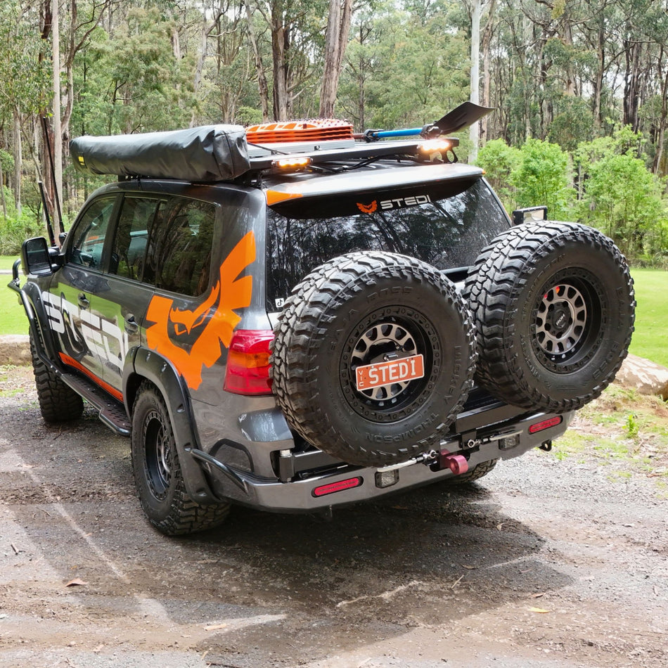 This is an image of the Raslarr V2 Rear Bar with Dual Wheel Carriers and jerry can holders on the Stedi LED Lights 200 Series Toyota Landcruiser in Lilydale, Melbourne, Australia, Cape York
