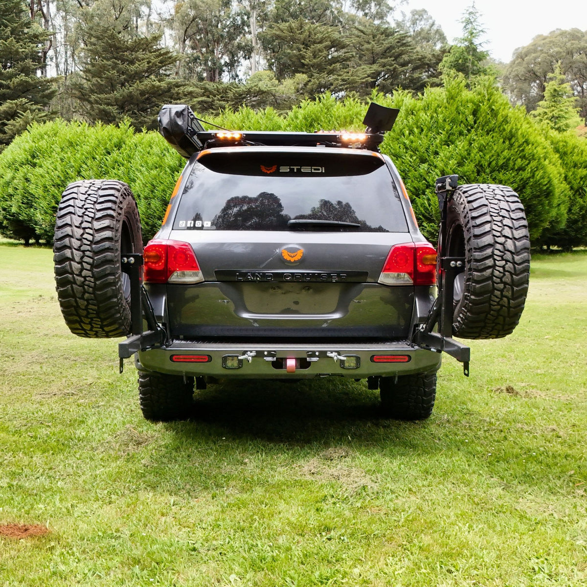 This is an image of the Raslarr V2 Rear Bar with Dual Wheel Carriers on the Stedi LED Lights 200 Series Toyota Landcruiser in Lilydale, Melbourne, Cape York, Uluru, VIC High Country